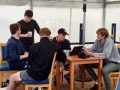 Sutton-team-in-discussion-before-the-briefing